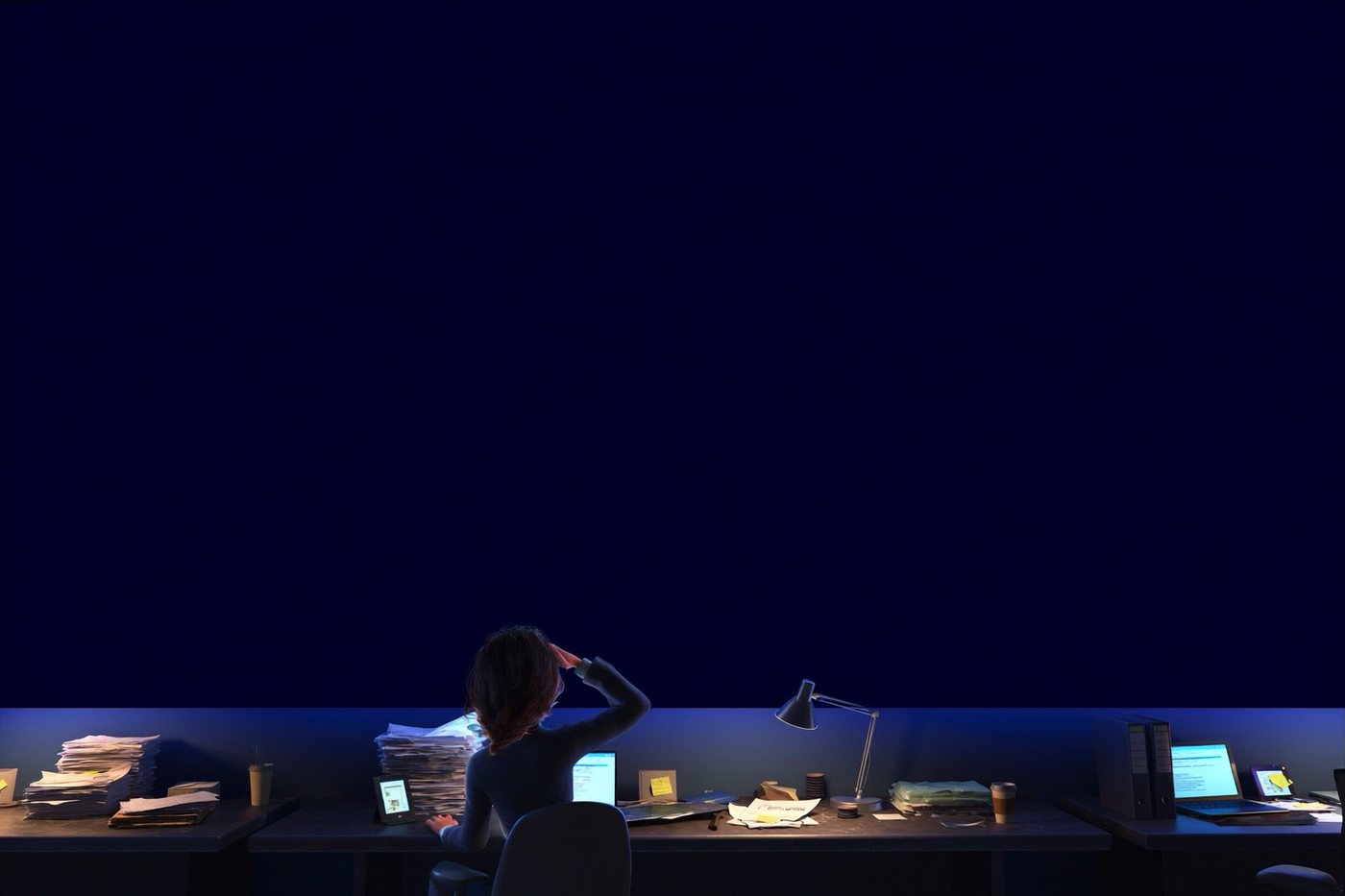 A programme manager working late, buried in exports, trackers and printouts, in front of a blank wall screen